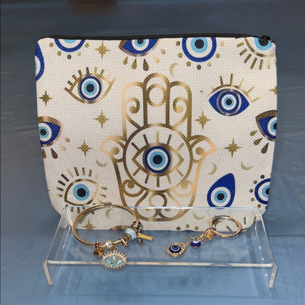 Elegant Hamsa Eye Cosmetic Bag in Blue and Gold with bracelet & key charm